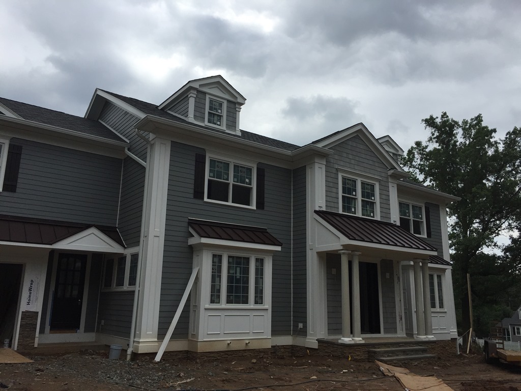 Siding, windows and exterior trim during a company project